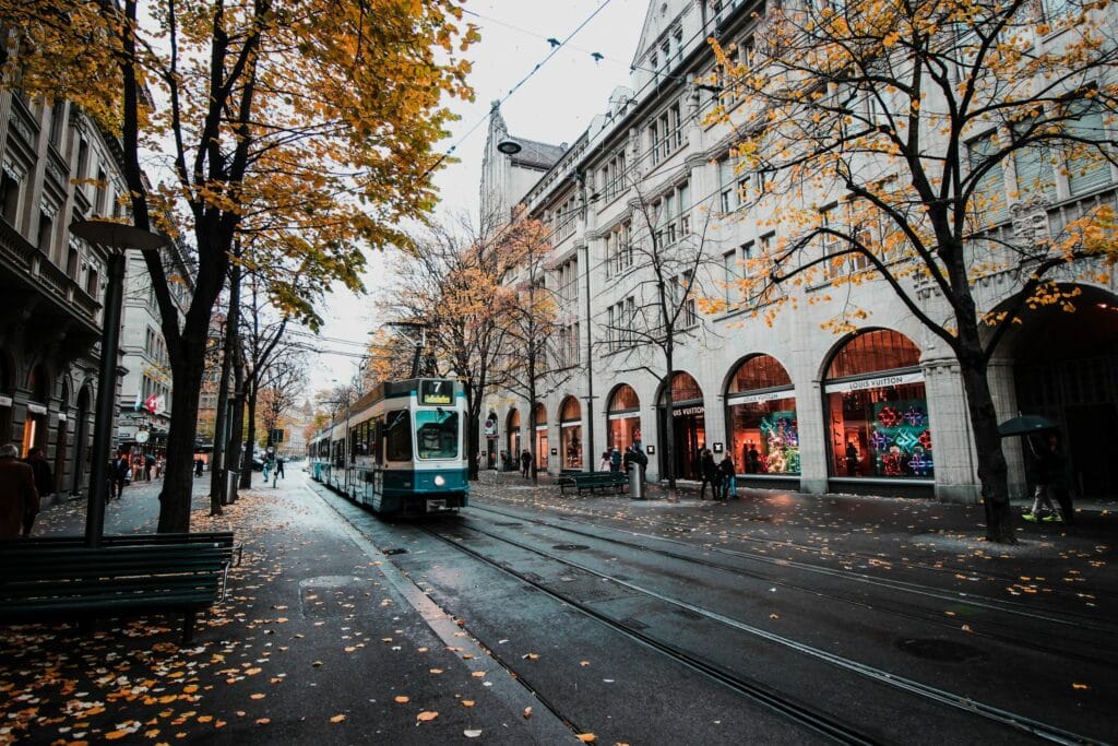 Commercial Real Estate Metrics, Wet Street with a Tram in Front of a Shopping Center